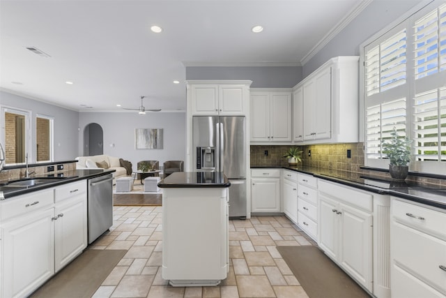 7513 Sugarbush Dr, Garland, TX 75044 - kitchen with appliances with stainless steel finishes, a sink, decorative backsplash, stone tile floors, and recessed lighting