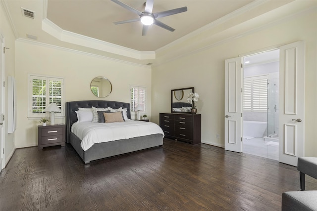 7513 Sugarbush Dr, Garland, TX 75044 - bedroom featuring a tray ceiling, crown molding, dark wood-type flooring, connected bathroom, and baseboards