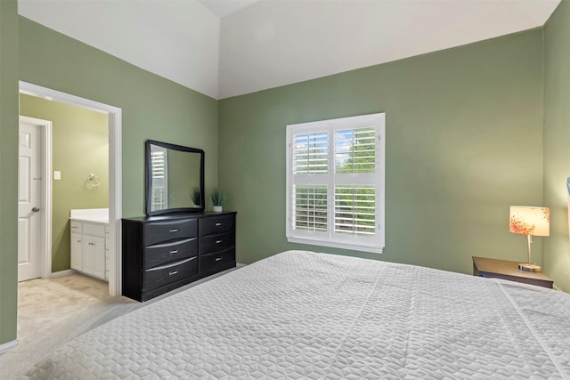 7513 Sugarbush Dr, Garland, TX 75044 - bedroom with light colored carpet, vaulted ceiling, ensuite bath, and baseboards