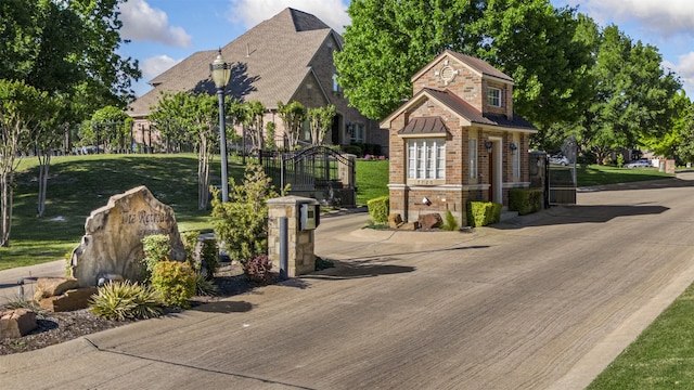 7513 Sugarbush Dr, Garland, TX 75044 - view of front facade featuring brick siding, a front lawn, and stone siding