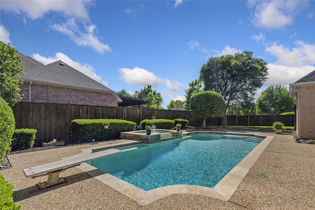 7513 Sugarbush Dr, Garland, TX 75044 - view of swimming pool featuring a fenced backyard, a pool with connected hot tub, and a diving board