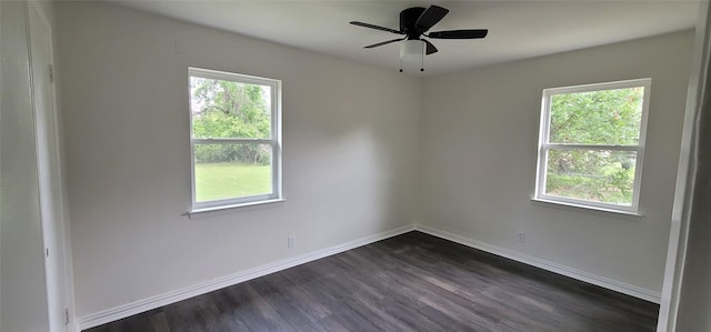6216 Maurie Dr, Watauga, TX 76148 - empty room featuring dark wood-style flooring, baseboards, and a ceiling fan