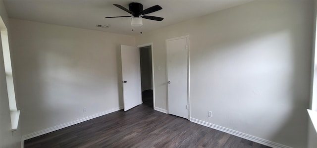 6216 Maurie Dr, Watauga, TX 76148 - spare room featuring dark wood-type flooring, a ceiling fan, and baseboards
