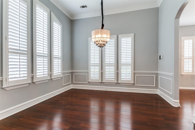 1121 Riverwalk Ct, Colleyville, TX 76034 - unfurnished dining area with arched walkways, healthy amount of natural light, a chandelier, dark wood-style floors, and crown molding