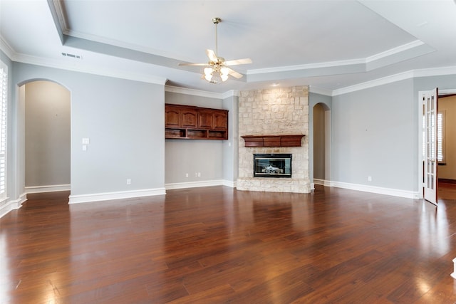 1121 Riverwalk Ct, Colleyville, TX 76034 - unfurnished living room featuring arched walkways, a raised ceiling, a ceiling fan, and crown molding
