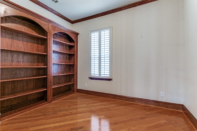 1121 Riverwalk Ct, Colleyville, TX 76034 - empty room with wood finished floors, healthy amount of natural light, baseboards, and crown molding
