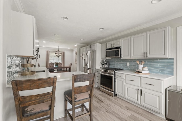 12212 Ridgefair Pl, Farmers Branch, TX 75234 - kitchen with stainless steel appliances, tasteful backsplash, a peninsula, light countertops, and ornamental molding