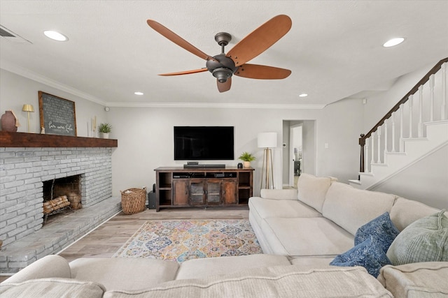 12212 Ridgefair Pl, Farmers Branch, TX 75234 - living room featuring wood finished floors, recessed lighting, a ceiling fan, ornamental molding, and a fireplace