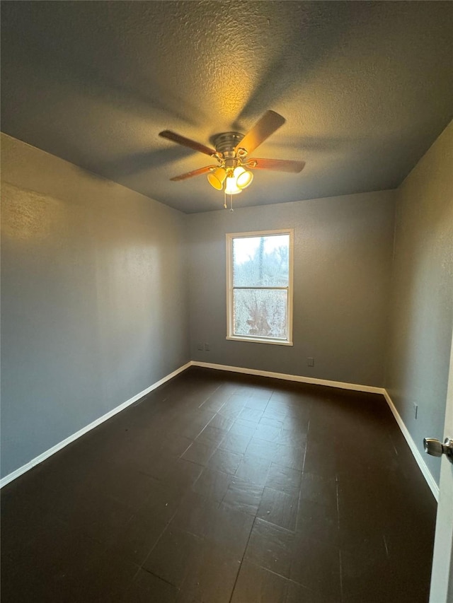 825 Willow Dr, Shreveport, LA 71118 - empty room with a ceiling fan, a textured ceiling, and baseboards