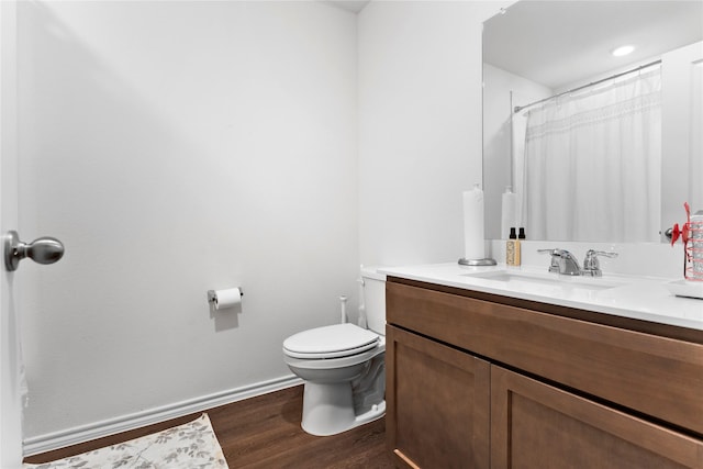 516 Wrangler Dr, Josephine, TX 75189 - bathroom with wood finished floors, toilet, vanity, and baseboards