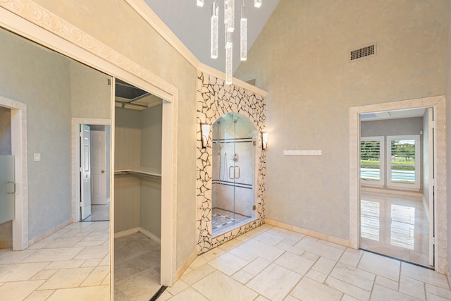 2709 Oak Point Dr, Garland, TX 75044 - interior space with baseboards, a high ceiling, and stone tile flooring