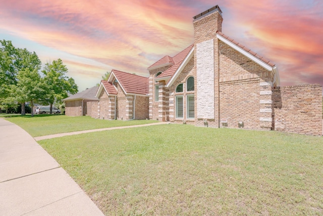 2709 Oak Point Dr, Garland, TX 75044 - view of front of house featuring a chimney, a front yard, and a tile roof