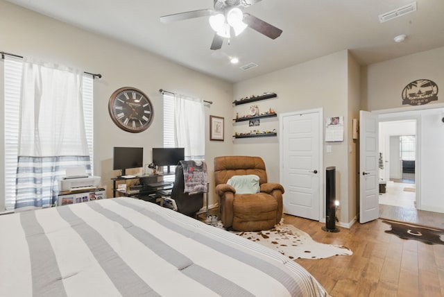 1063 Dominique Dr, Weatherford, TX 76087 - bedroom with wood finished floors, ceiling fan, and baseboards