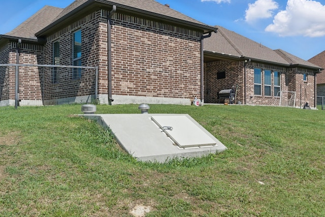 1063 Dominique Dr, Weatherford, TX 76087 - entry to storm shelter with a lawn