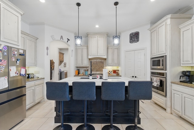 1063 Dominique Dr, Weatherford, TX 76087 - kitchen with stainless steel appliances, tasteful backsplash, a breakfast bar, recessed lighting, and pendant lighting