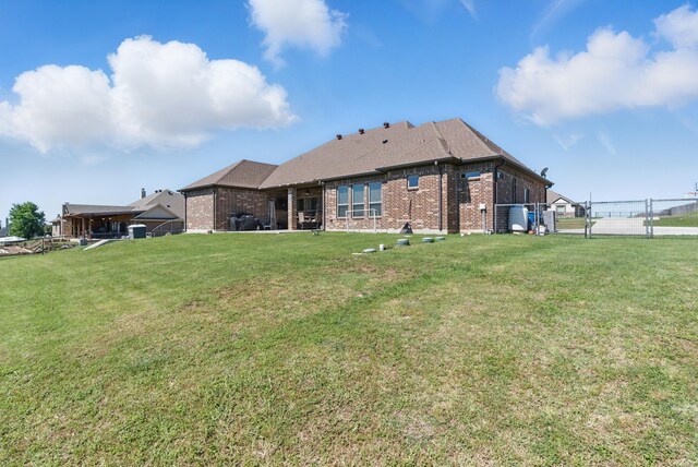 1063 Dominique Dr, Weatherford, TX 76087 - rear view of house with brick siding