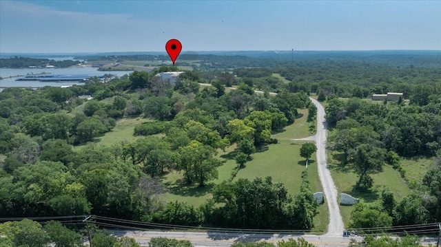 7750 Hanger Cutoff Rd, Fort Worth, TX 76135 - drone / aerial view of a nearby body of water and a heavily wooded area