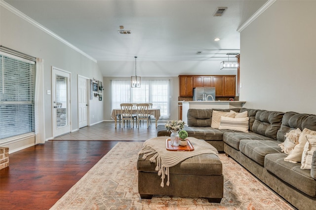 1730 Vista Ridge Dr W, Midlothian, TX 76065 - living area with ornamental molding, wood finished floors, and baseboards