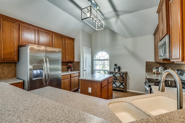 1730 Vista Ridge Dr W, Midlothian, TX 76065 - kitchen with appliances with stainless steel finishes, a sink, brown cabinetry, vaulted ceiling, and tasteful backsplash