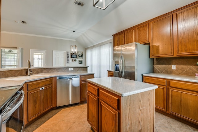 1730 Vista Ridge Dr W, Midlothian, TX 76065 - kitchen featuring stainless steel appliances, light tile patterned floors, a sink, brown cabinets, and decorative backsplash