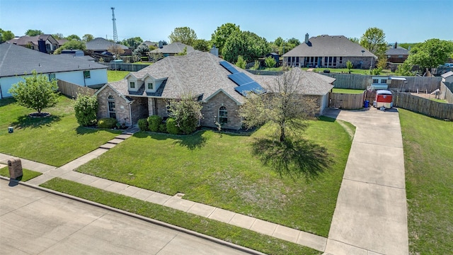 1730 Vista Ridge Dr W, Midlothian, TX 76065 - view of front of home with a residential view, solar panels, driveway, and stone siding