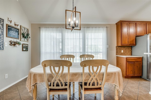 1730 Vista Ridge Dr W, Midlothian, TX 76065 - dining space with a chandelier, vaulted ceiling, light tile patterned floors, and baseboards