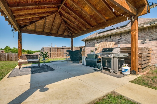 1730 Vista Ridge Dr W, Midlothian, TX 76065 - fenced backyard with grilling area, a patio area, and a gazebo