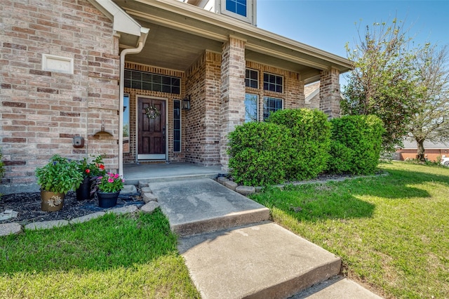1730 Vista Ridge Dr W, Midlothian, TX 76065 - view of exterior entry featuring a yard, covered porch, and brick siding