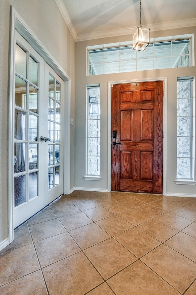 1730 Vista Ridge Dr W, Midlothian, TX 76065 - foyer with crown molding, light tile patterned floors, french doors, plenty of natural light, and baseboards