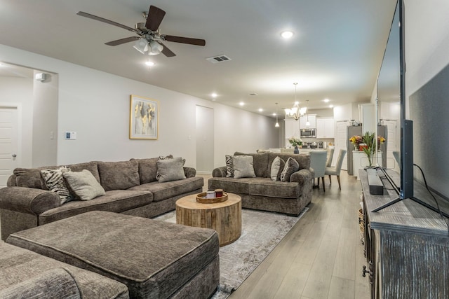 604 Hazeltine Rd, Red Oak, TX 75154 - living area featuring ceiling fan, a chandelier, light wood finished floors, and recessed lighting