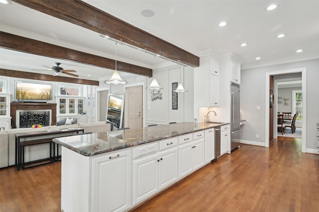 3008 Rosedale Ave, University Park, TX 75205 - kitchen featuring high quality fridge, wood finished floors, white cabinets, crown molding, and recessed lighting