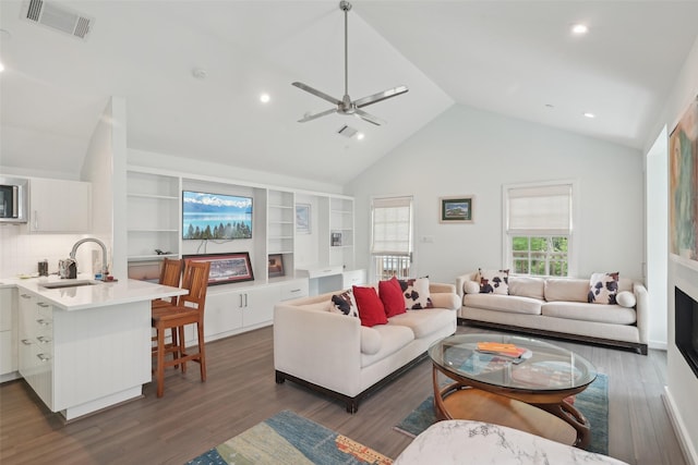 3008 Rosedale Ave, University Park, TX 75205 - living room with ceiling fan, dark wood-type flooring, a fireplace, high vaulted ceiling, and recessed lighting