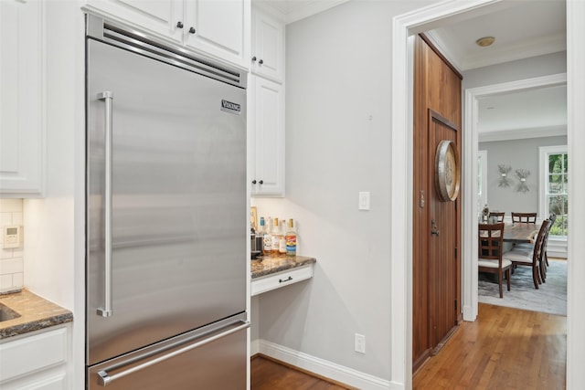 3008 Rosedale Ave, University Park, TX 75205 - kitchen featuring stainless steel built in refrigerator, wood finished floors, ornamental molding, and white cabinetry