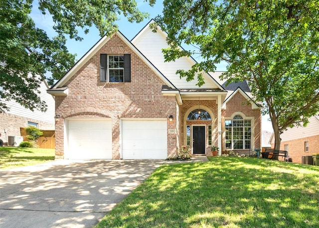 529 Mattie Ln, Lake Dallas, TX 75065 - traditional-style house with driveway, central AC unit, a front lawn, and a garage