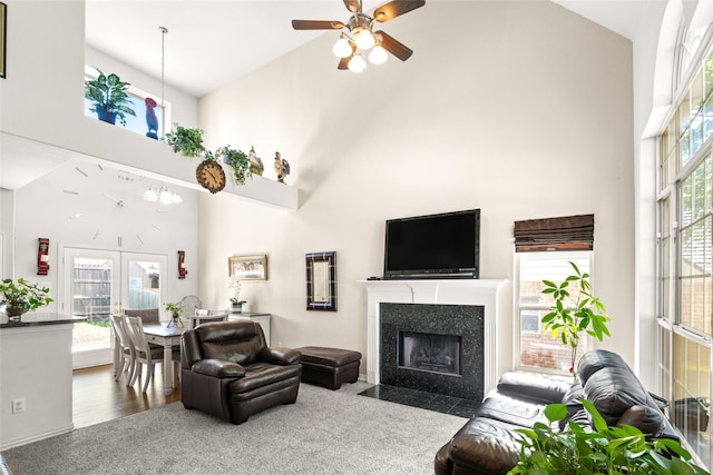 529 Mattie Ln, Lake Dallas, TX 75065 - living area with high vaulted ceiling, ceiling fan, and a fireplace with flush hearth
