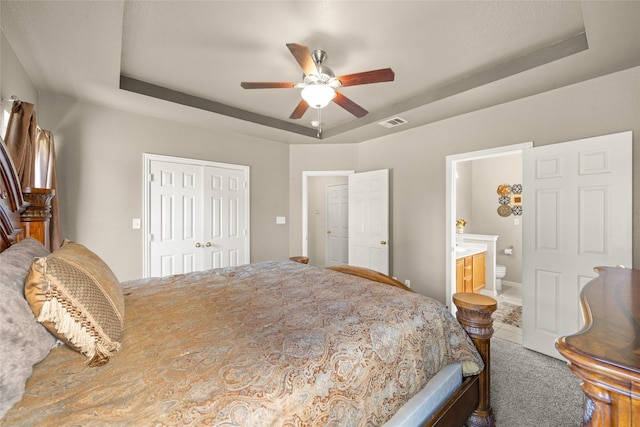 529 Mattie Ln, Lake Dallas, TX 75065 - bedroom with a raised ceiling, a closet, ensuite bath, and ceiling fan