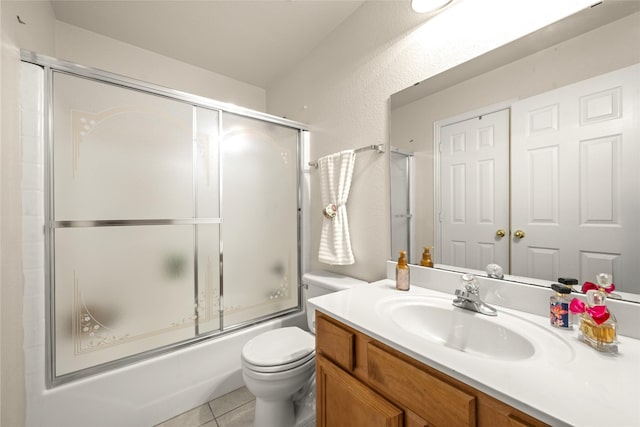 529 Mattie Ln, Lake Dallas, TX 75065 - bathroom featuring toilet, vanity, shower / bath combination with glass door, and tile patterned flooring