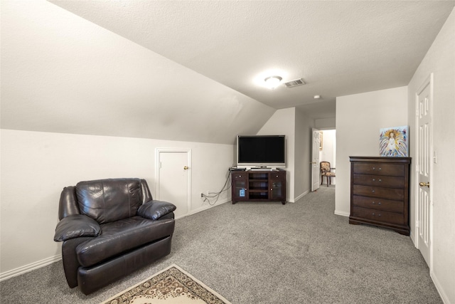 529 Mattie Ln, Lake Dallas, TX 75065 - living area with carpet, vaulted ceiling, baseboards, and a textured ceiling