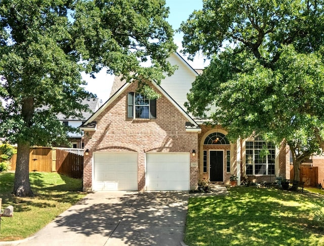 529 Mattie Ln, Lake Dallas, TX 75065 - view of front of home with brick siding, driveway, and a garage