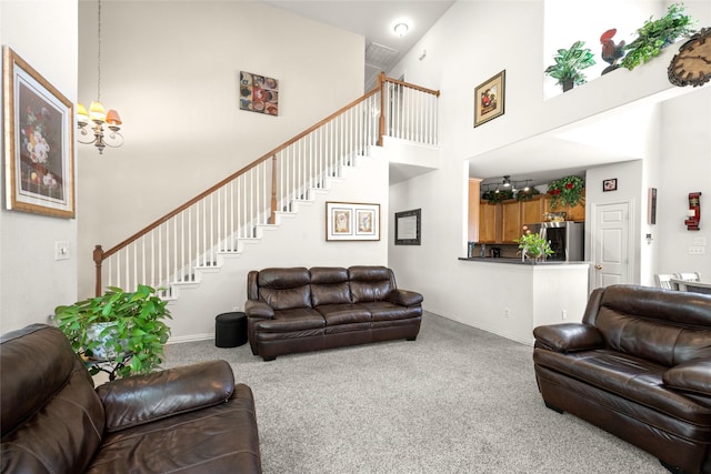 529 Mattie Ln, Lake Dallas, TX 75065 - carpeted living room with a chandelier, a high ceiling, stairs, and baseboards