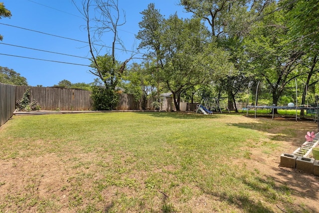 6217 Kentwood Pl, Fort Worth, TX 76112 - view of yard featuring a trampoline and a playground
