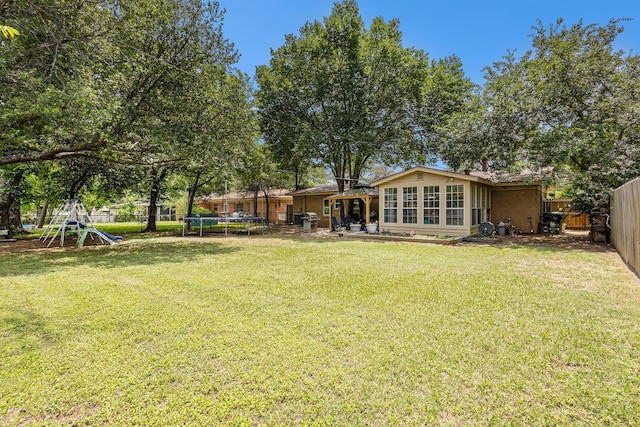 6217 Kentwood Pl, Fort Worth, TX 76112 - view of yard featuring a trampoline
