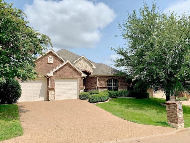 10954 Live Oak Creek Dr, Fort Worth, TX 76108 - view of front of house with concrete driveway, a front lawn, an attached garage, brick siding, and stone siding
