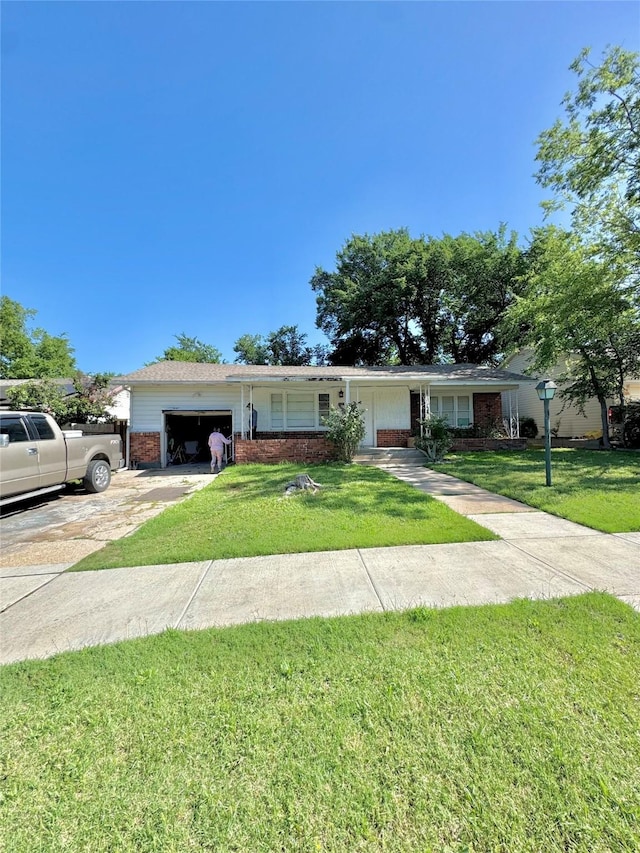 5521 Hightower St, Fort Worth, TX 76112 - single story home featuring concrete driveway, brick siding, a garage, and a front lawn