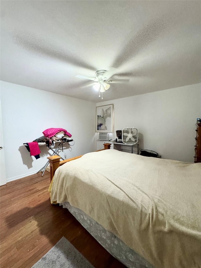 5521 Hightower St, Fort Worth, TX 76112 - bedroom with wood finished floors, a ceiling fan, a textured ceiling, and cooling unit