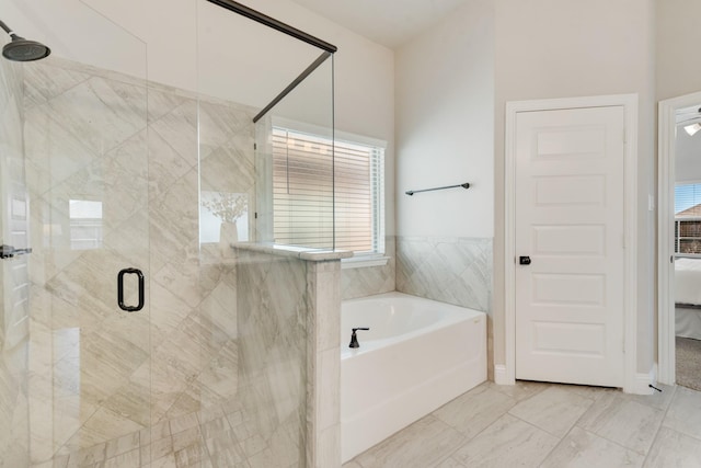 3234 Burke Dr, Royse City, TX 75189 - ensuite bathroom with a bath, a stall shower, and marble look tile flooring