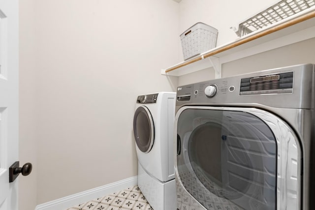 3234 Burke Dr, Royse City, TX 75189 - laundry room with washing machine and clothes dryer, baseboards, and tile patterned floors