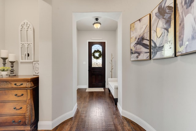 3234 Burke Dr, Royse City, TX 75189 - entrance foyer featuring dark wood-type flooring, baseboards, and arched walkways