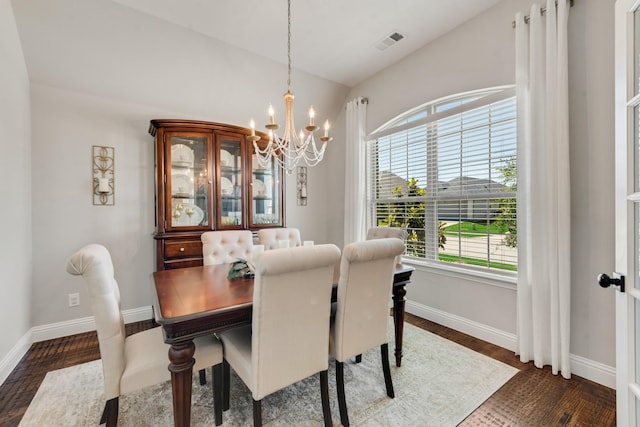 3234 Burke Dr, Royse City, TX 75189 - dining room with a chandelier, baseboards, vaulted ceiling, and dark wood-type flooring