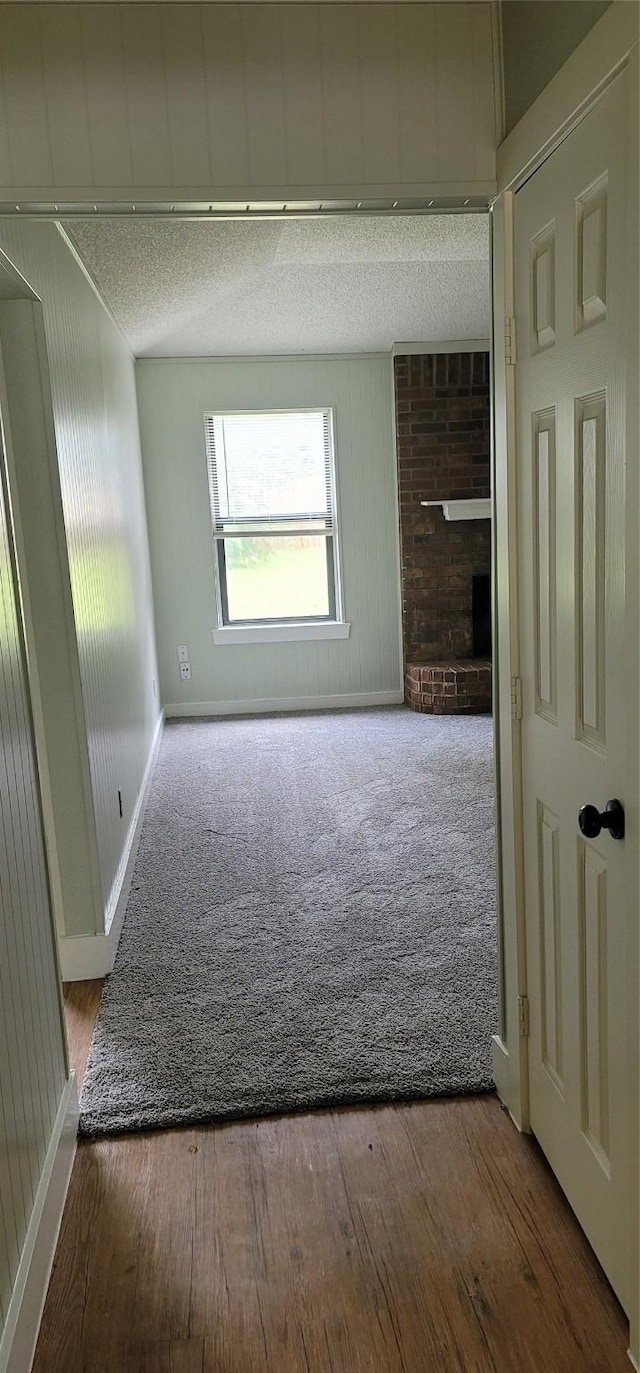 6436 Green Ridge Dr, Watauga, TX 76148 - unfurnished room featuring a textured ceiling, wood finished floors, and baseboards